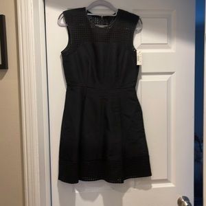 Black size 2 perforated top and bottom dress never worn with tag